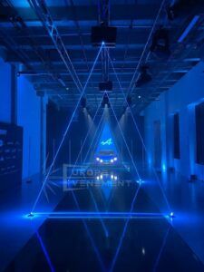 Europe Évènement - Personalised show - Photo of blue alpine car with triangle laser projection
