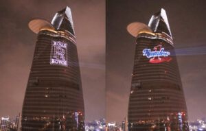 Europe Évènement - Logo projection and writing - Photo of two towers in Ho Chi Minh with two brand logos projected onto each one